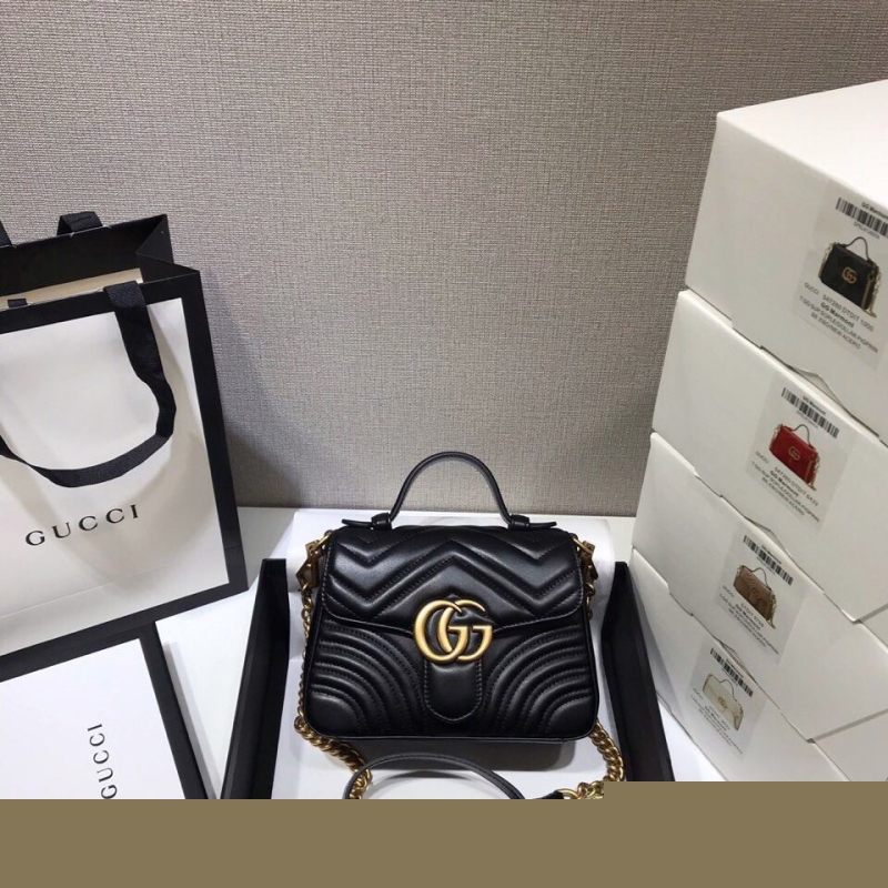 G*u*i top handle bags